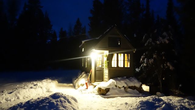 Off-grid Tiny House On Wheels Front View On Winter Night