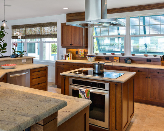 traditional kitchen island with cooktop and oven