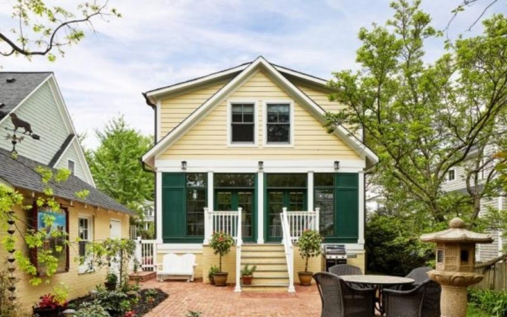 Black Gutters on Yellow House