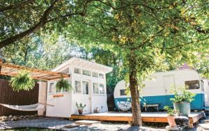 revamped vintage Shasta trailer that serves as an additional tiny house room