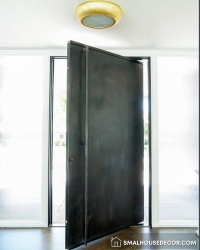Custom Steel Slab Door with Rivets