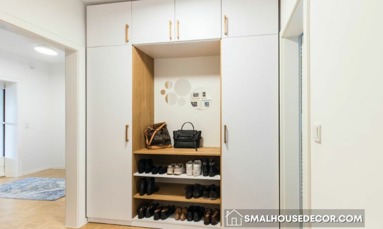 Top 4 Smart Storage Solutions for Tight Areas - a white closet with a shoe rack and a handbag
